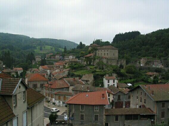 We eat chocolatebutter rolls after a rollercoaster descent to the pretty village of Olliergues.